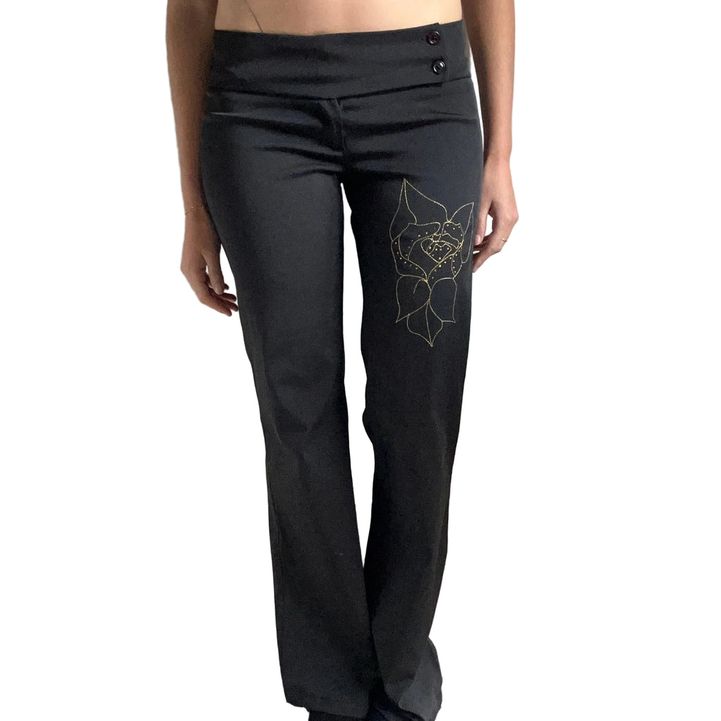 Black trousers with flower detail