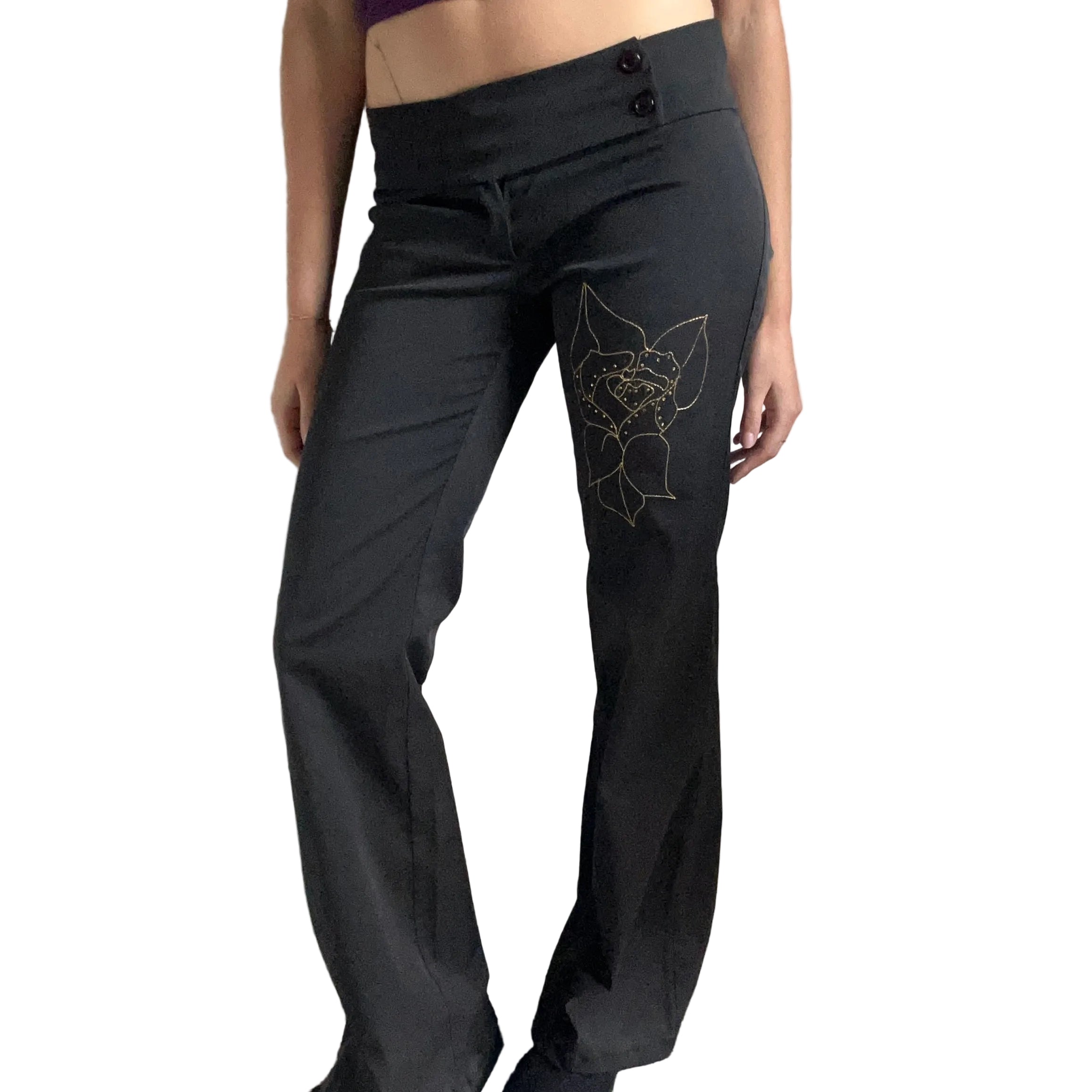 Black trousers with flower detail